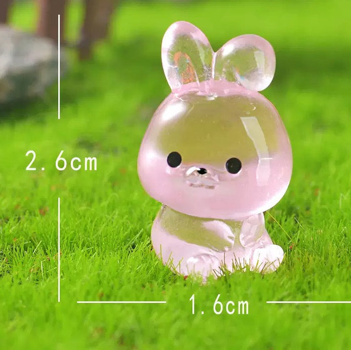 Glow in the dark pink bunny and puppy figurines