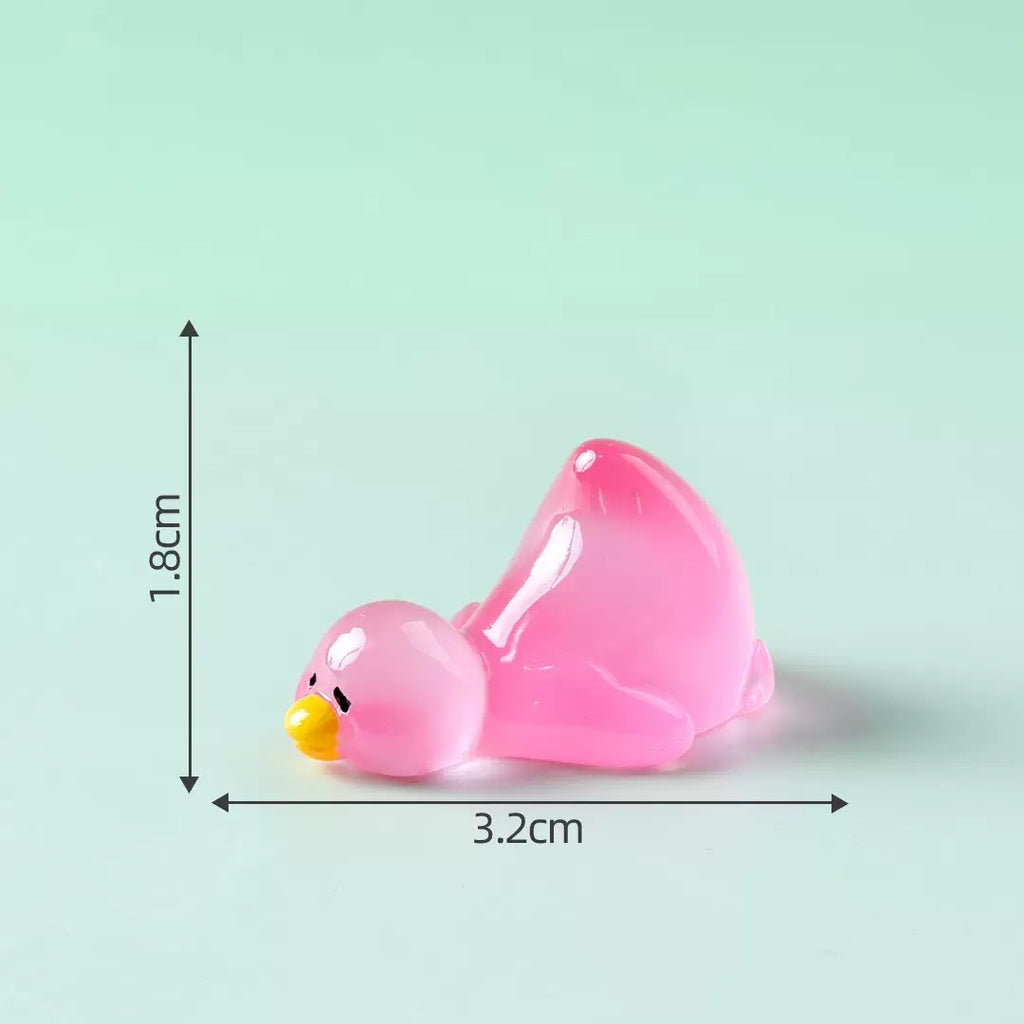 Lying pink duck resin charm size 1.8 by 3.2 cm