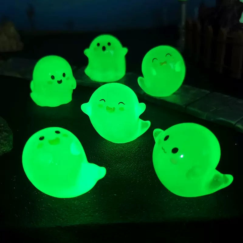 Ghost resin charms glowing green in the dark