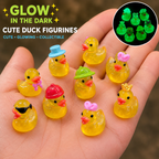 Glow in the dark cute duck figurines on hand