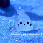 Glow in the dark seal pup resin charms approximately 17 by 10 mm