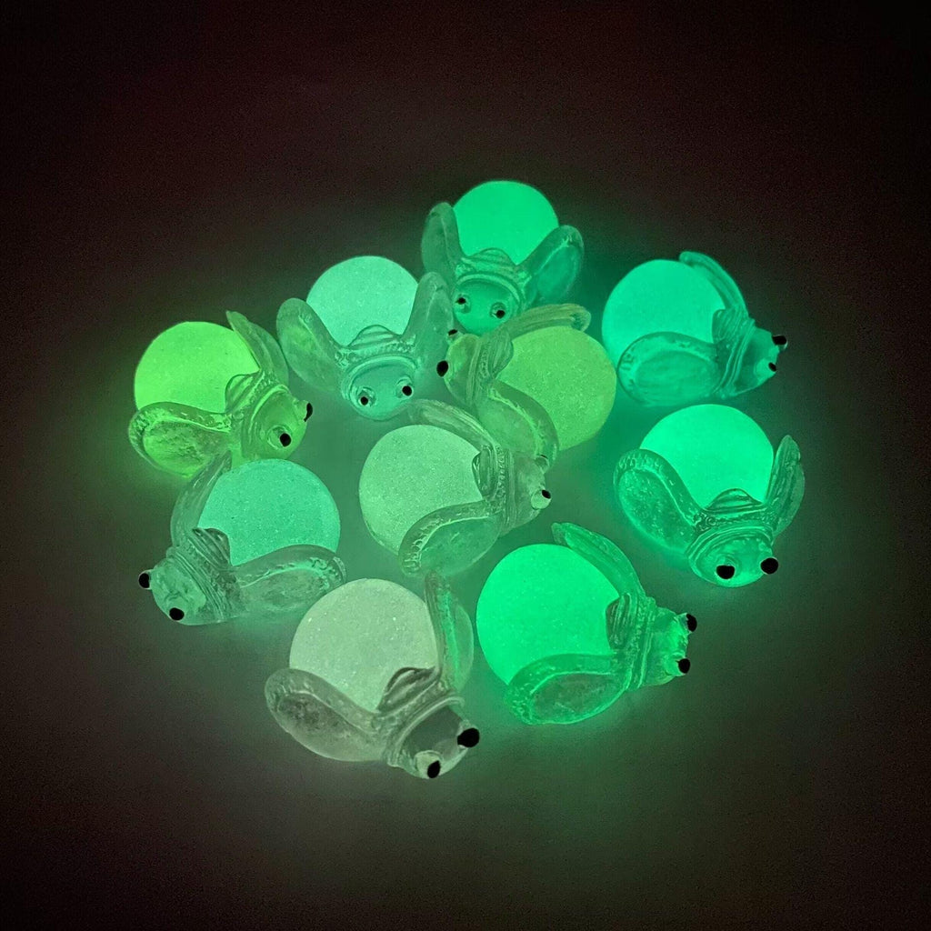 Glow in the dark ladybug and firefly resin charms approximately 22 by 13 mm