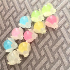 Glow in the dark ladybug and firefly resin charms approximately 22 by 13 mm