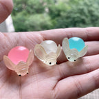 Glow in the dark ladybug and firefly resin charms approximately 22 by 13 mm