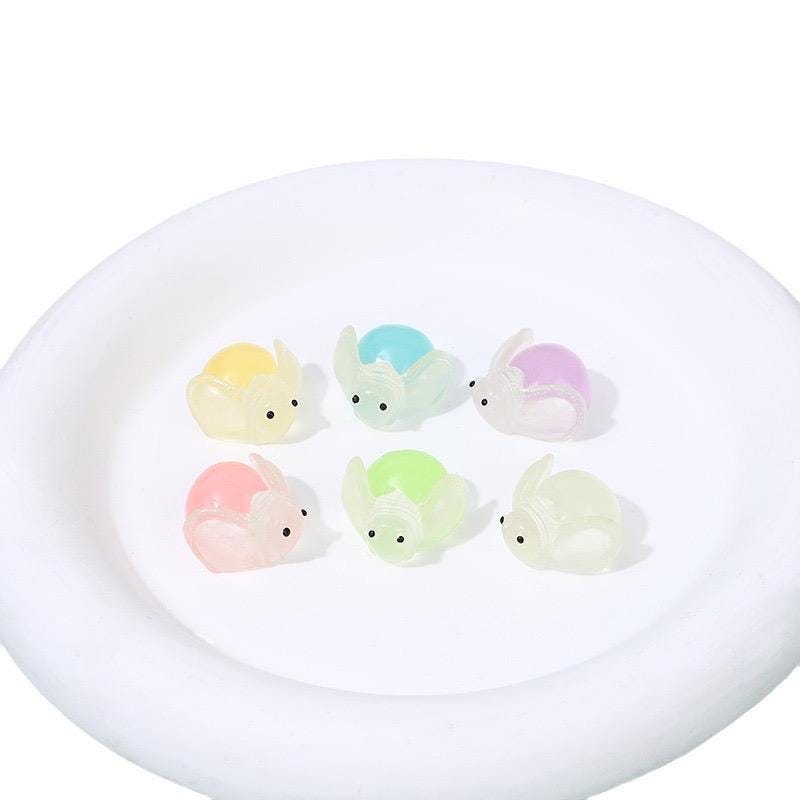 Glow in the dark ladybug and firefly resin charms approximately 22 by 13 mm